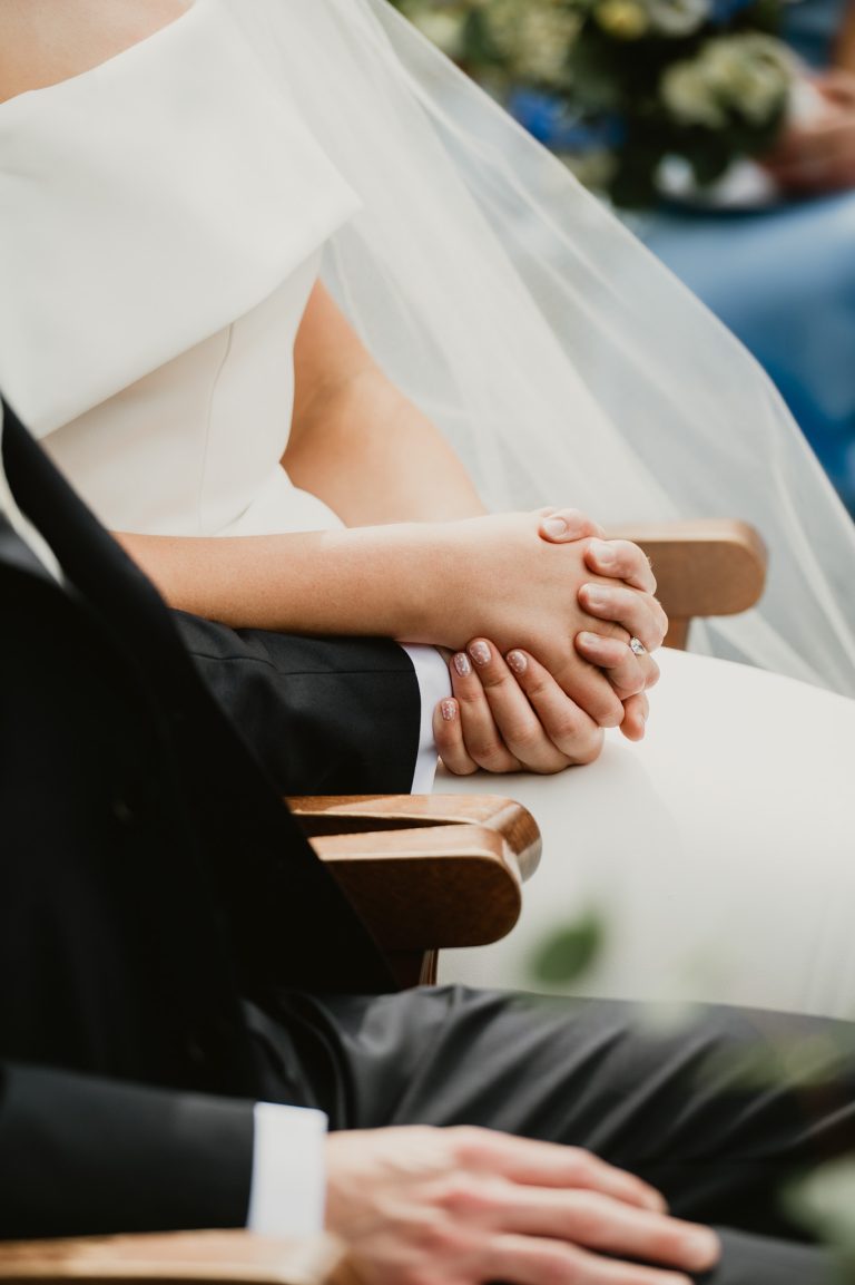 Sarah and Ollie at their Tinakilly House wedding in Ireland captured by a luxury wedding photographer, bride and groom holding hands ceremony close-up Tinakilly Country House wedding Ireland WeddingWithMe