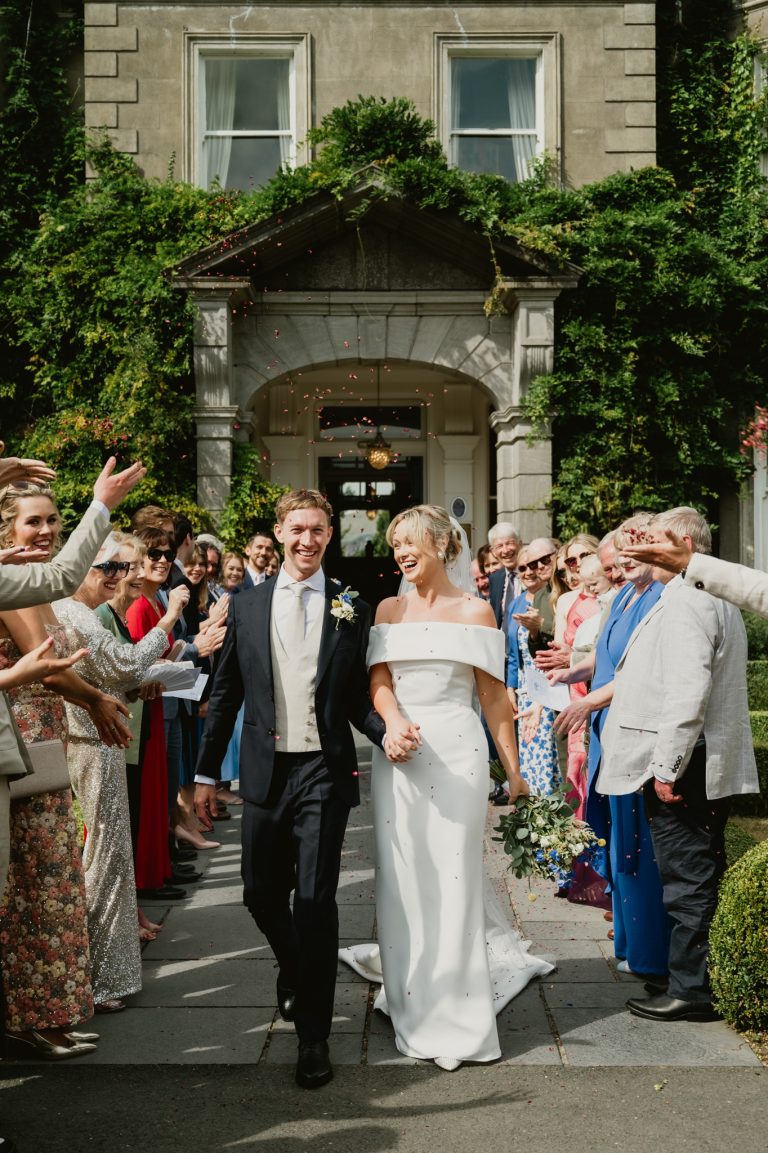 Tender and intimate moment of the bride and groom gazing into each other’s eyes at Tinakilly Country House in Ireland. This fine art wedding photograph captures love, connection, and emotion, emphasizing the couple’s bond and the elegance of their wedding day. Captured by WeddingWithMe, this image exemplifies professional wedding photography and videography, ideal for Irish wedding galleries, social media, and SEO-optimized luxury wedding website content.