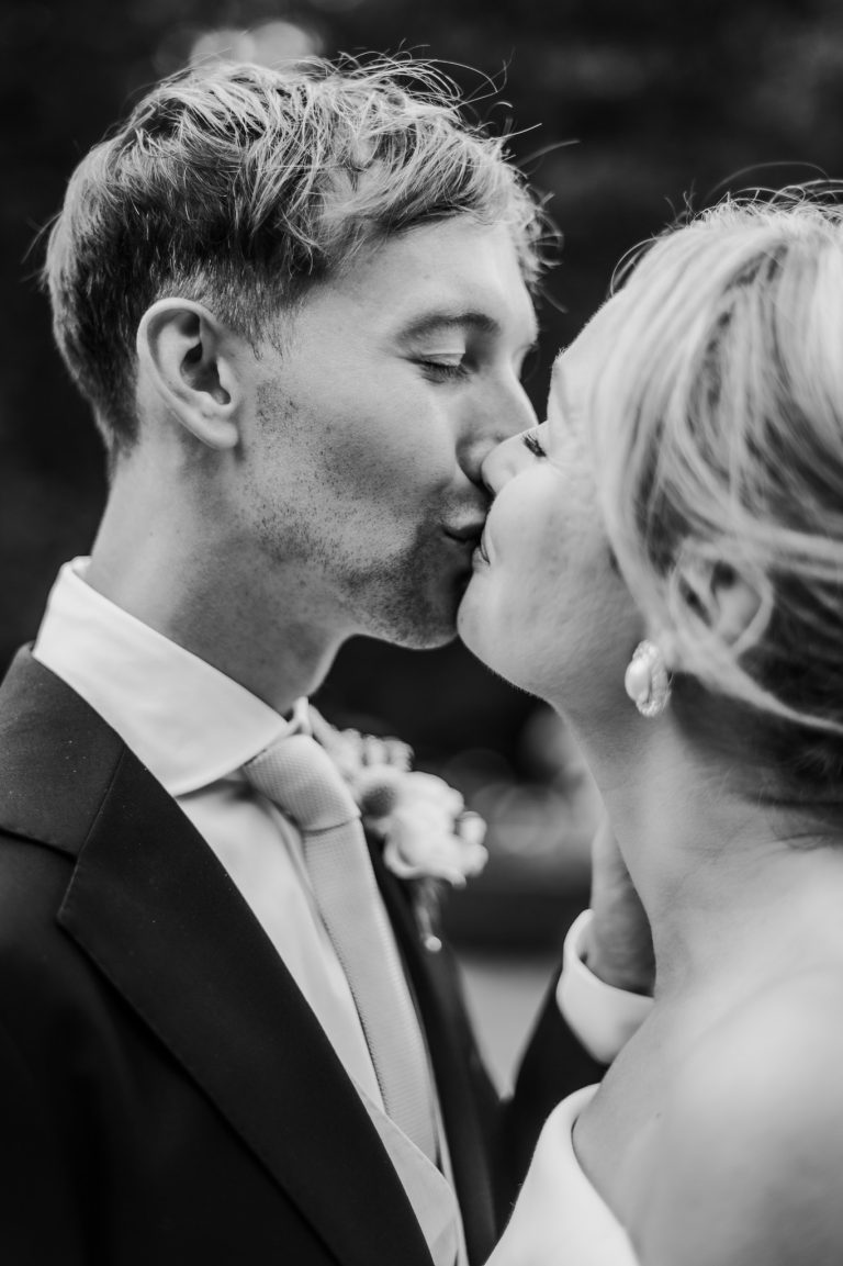 bride and groom kissing black and white Tinakilly Country House wedding Ireland WeddingWithMe