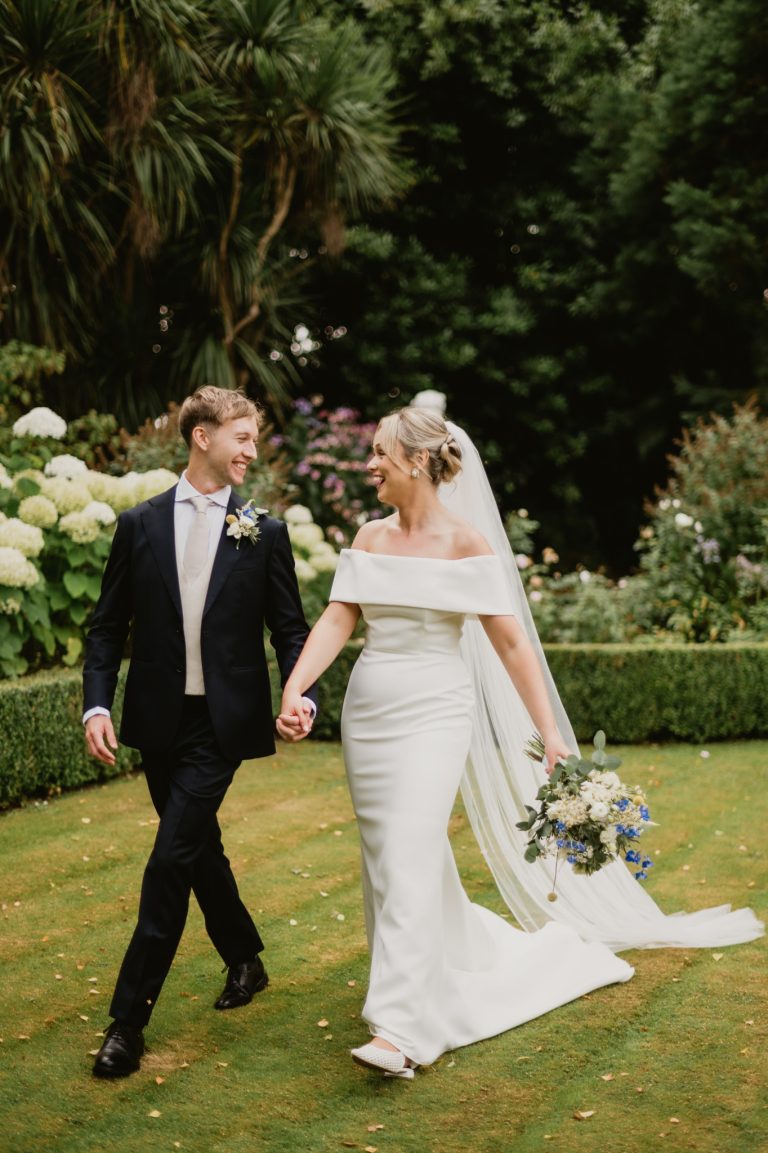 bride and groom holding hands garden photoshoot Tinakilly Country House wedding Ireland WeddingWithMe