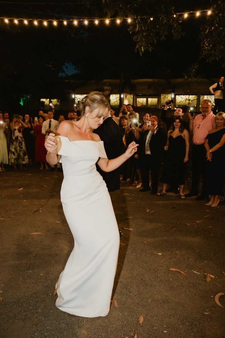 Enchanting first dance of the bride and groom in the forest outdoors at Tinakilly Country House in Ireland, surrounded by their guests. This fine art wedding photograph captures romance, elegance, and the magical atmosphere of an outdoor celebration. Photographed by WeddingWithMe, it showcases professional wedding photography and videography, ideal for Irish wedding galleries, social media, and SEO-optimized luxury wedding website content.