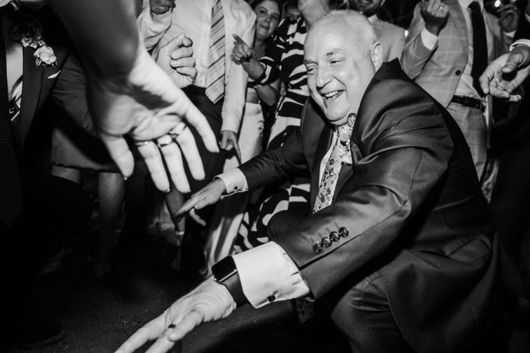 Heartwarming and joyful moment of the bride laughing and dancing with friends and family at Tinakilly Country House. This photograph captures the happiness, love, and festive spirit of the wedding reception. Captured by WeddingWithMe, ideal for social media, galleries, and SEO.