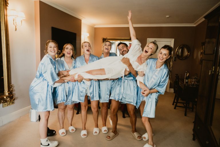 bride lifted by bridesmaids getting ready Tinakilly Country House wedding Ireland WeddingWithMe