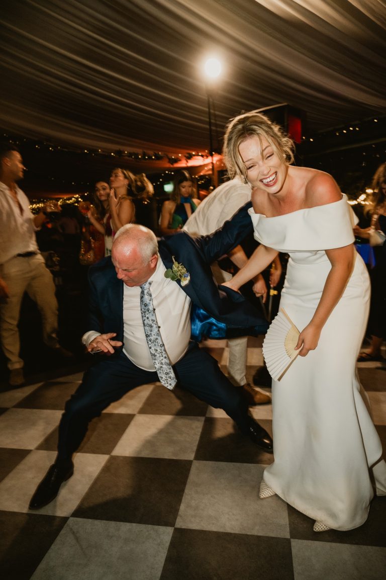 Joyful and lively moment of the bride dancing and celebrating during the wedding party at Tinakilly Country House in Ireland. This fine art wedding photograph captures fun, happiness, and the festive atmosphere of the reception. Photographed by WeddingWithMe, it showcases professional wedding photography and videography, ideal for Irish wedding galleries, social media, and SEO-optimized luxury wedding website content.