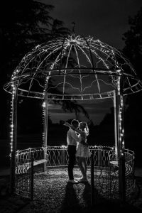 Romantic evening couple portrait in garden with creative lighting at Ballykealey House captured by WeddingWithMe in Ireland