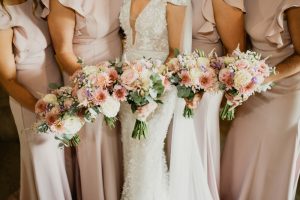 Bridal party holding bouquets during wedding ceremony at Ballykealey House captured by WeddingWithMe in Ireland